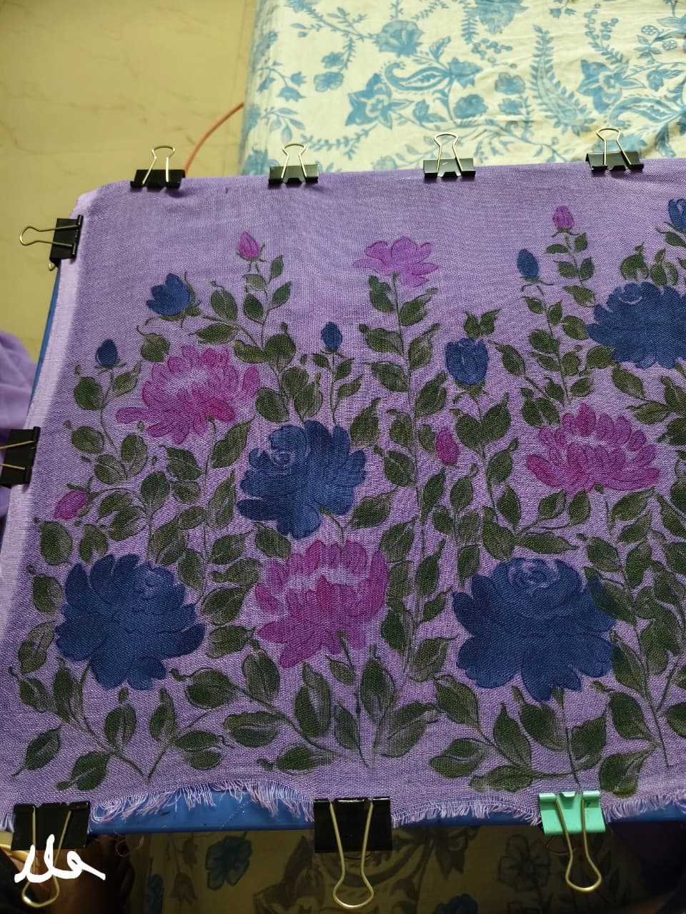 Hand painted saree online showcasing elegant floral artwork and traditional design